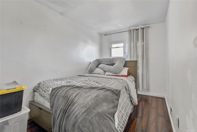 bedroom featuring dark hardwood / wood-style floors