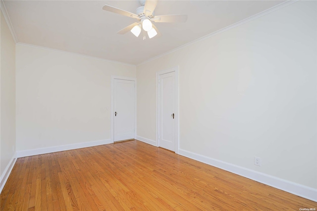 empty room featuring ceiling fan, light hardwood / wood-style floors, and ornamental molding