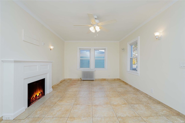 unfurnished living room featuring radiator heating unit, ceiling fan, crown molding, and light tile patterned flooring