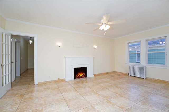 unfurnished living room with ceiling fan, radiator heating unit, ornamental molding, and light tile patterned floors