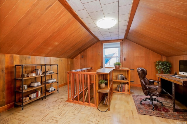 office space featuring wood walls, light parquet flooring, wooden ceiling, and lofted ceiling