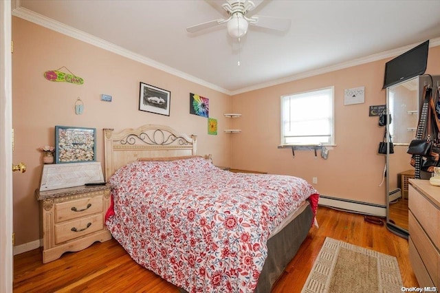 bedroom with ceiling fan, crown molding, a baseboard radiator, and dark hardwood / wood-style floors