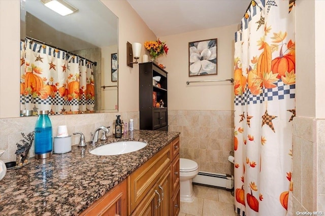 bathroom featuring vanity, tile patterned flooring, toilet, tile walls, and a baseboard radiator