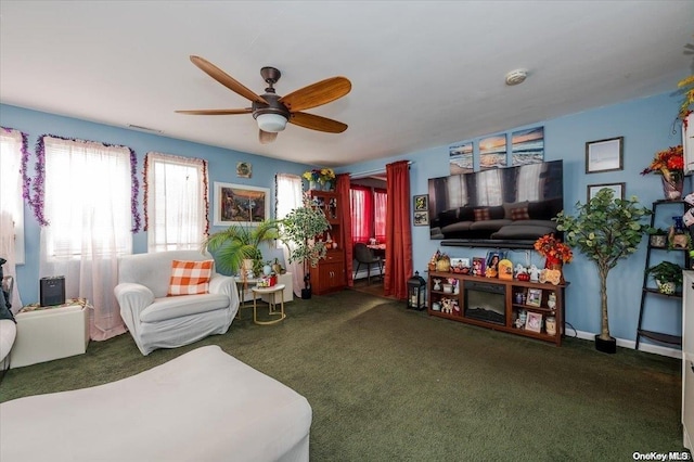 carpeted living room with ceiling fan