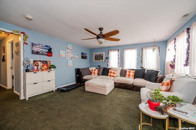 carpeted living room with ceiling fan