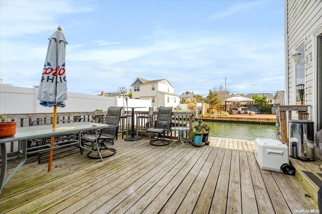 wooden deck featuring a water view