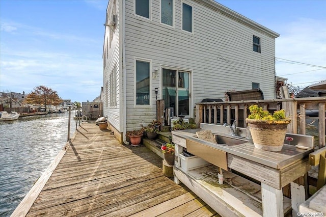 back of house with a water view