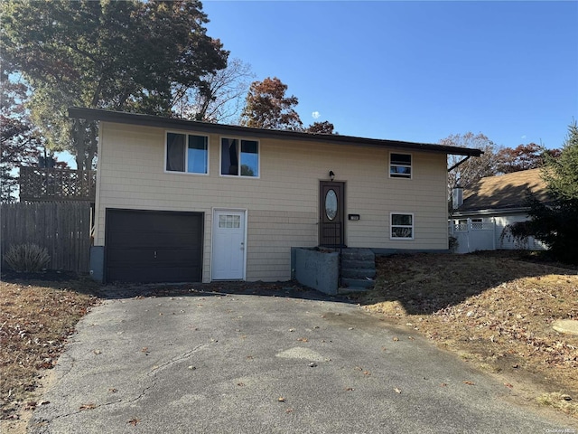 bi-level home featuring a garage