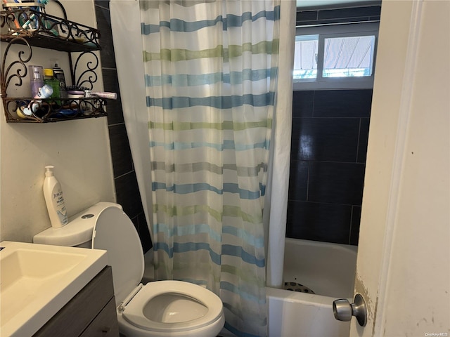 full bathroom featuring vanity, toilet, and shower / bath combo with shower curtain