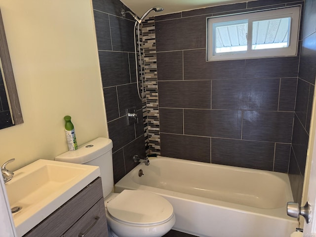full bath featuring shower / bathtub combination, toilet, and vanity