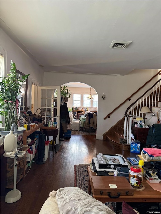 living room with dark hardwood / wood-style flooring