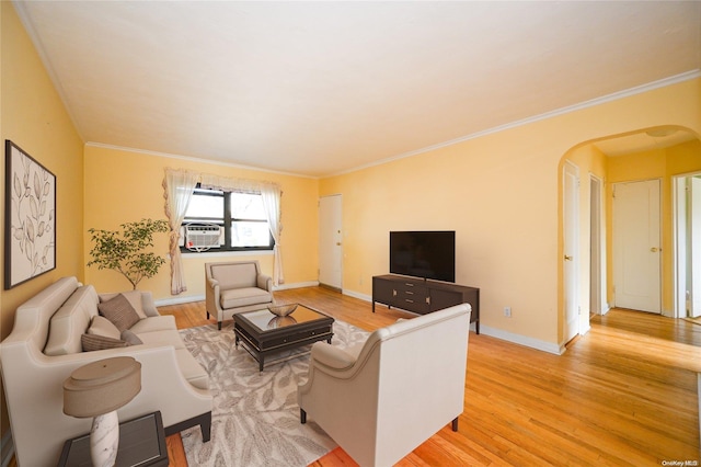 living room with crown molding and light wood-type flooring