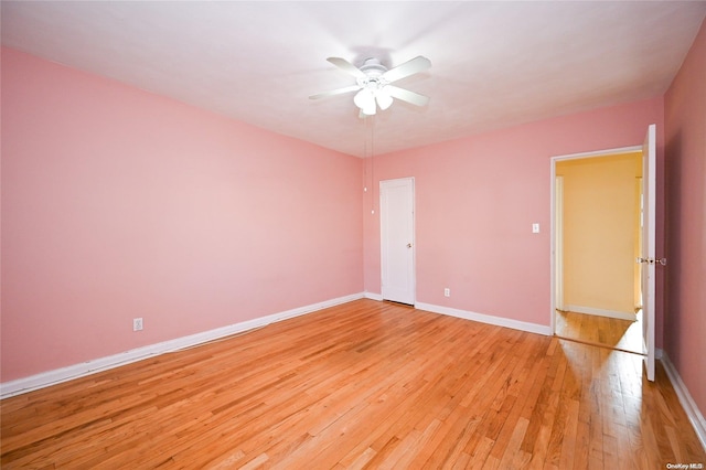 unfurnished room with ceiling fan and light hardwood / wood-style floors