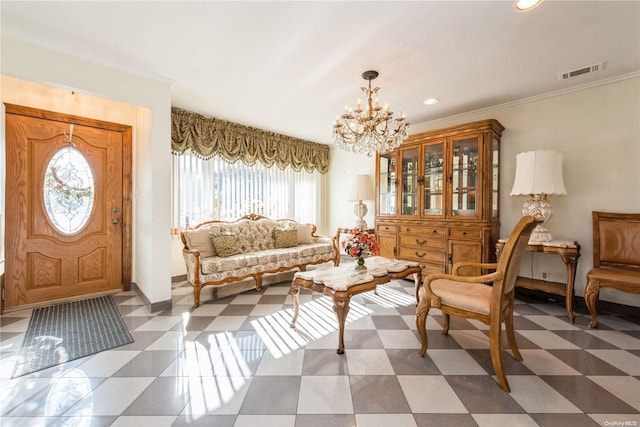 sitting room with crown molding and a chandelier