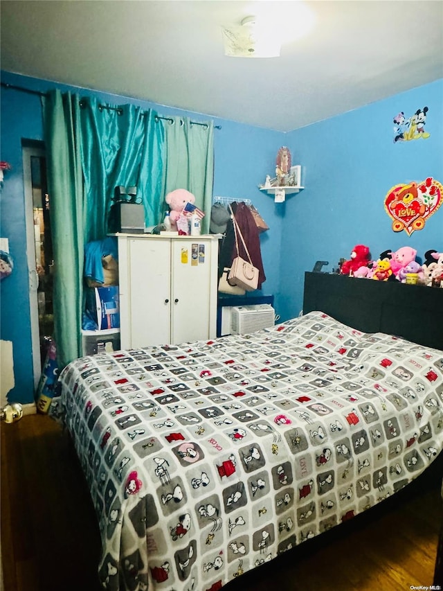 bedroom featuring wood-type flooring