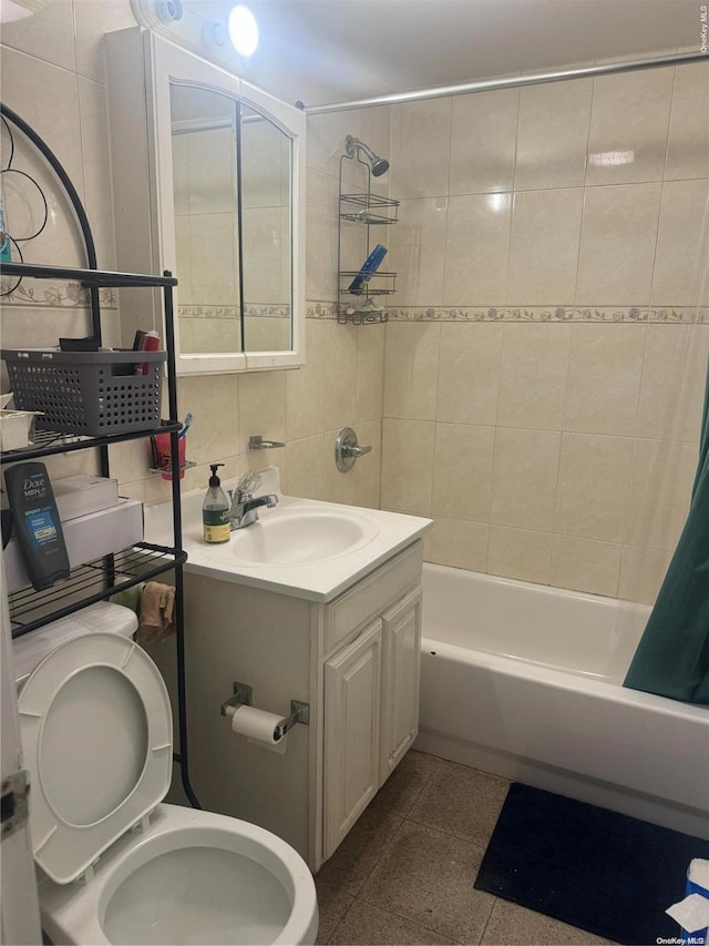 full bathroom featuring vanity, shower / bath combination with curtain, toilet, and tile walls