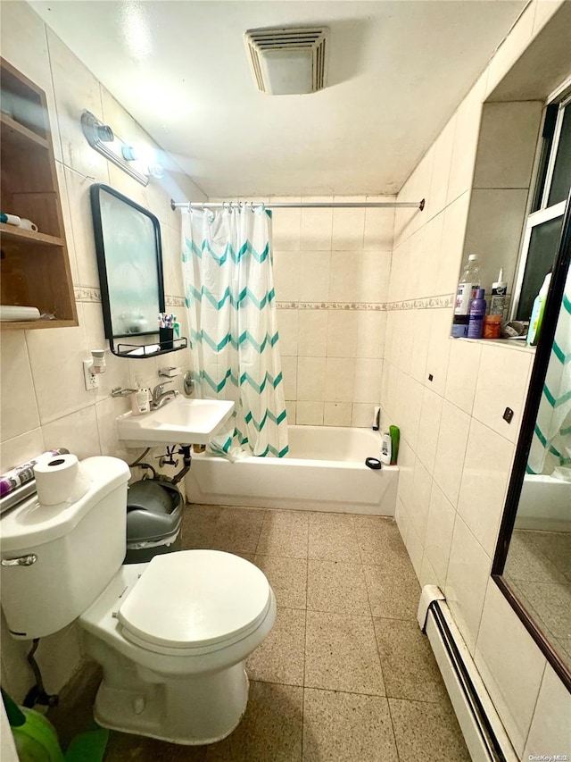 full bathroom featuring shower / tub combo, sink, a baseboard radiator, tile walls, and toilet