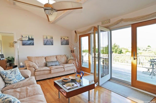 living room featuring ceiling fan, light hardwood / wood-style floors, french doors, and lofted ceiling with beams