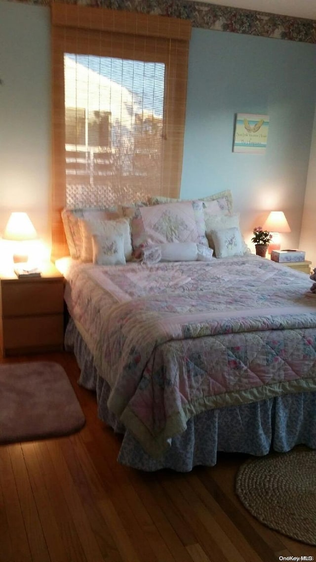 bedroom with wood-type flooring