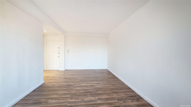 corridor featuring dark wood-type flooring