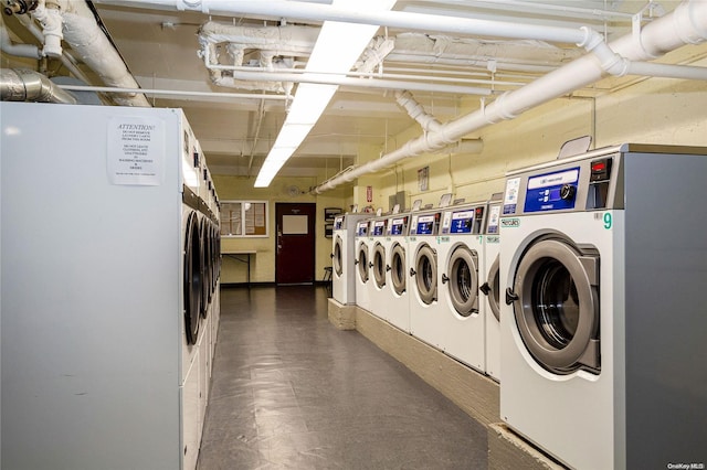 washroom featuring washing machine and clothes dryer