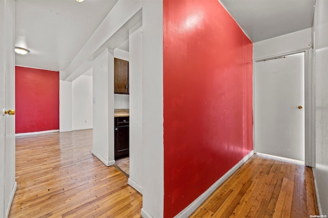 hall with light hardwood / wood-style floors