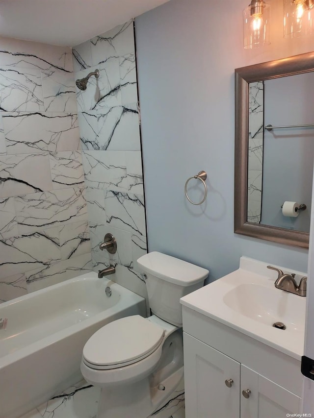 full bathroom with vanity, tiled shower / bath combo, and toilet