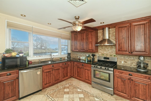 kitchen with backsplash, sink, wall chimney exhaust hood, and stainless steel appliances