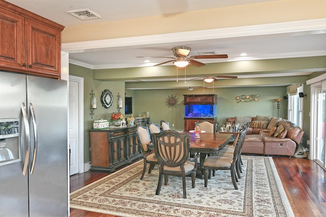 dining area with dark hardwood / wood-style floors, ceiling fan, and crown molding