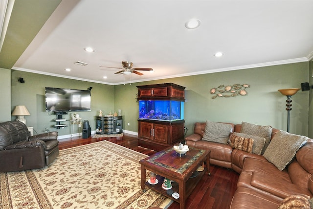 living room featuring dark hardwood / wood-style floors, ceiling fan, and ornamental molding