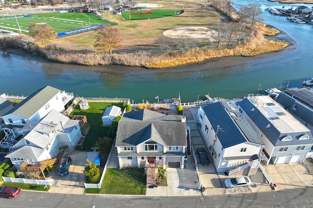 birds eye view of property with a water view