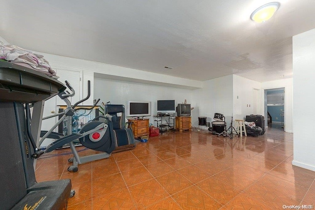 workout room with tile patterned floors