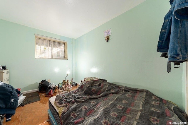 bedroom featuring vaulted ceiling