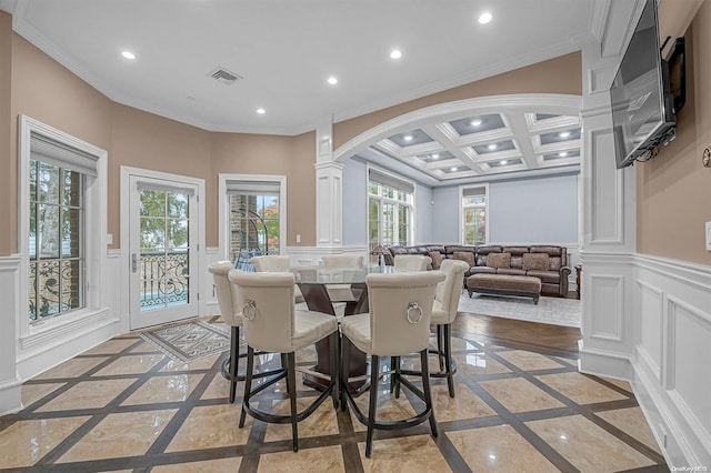 dining space featuring ornate columns, beamed ceiling, coffered ceiling, and ornamental molding