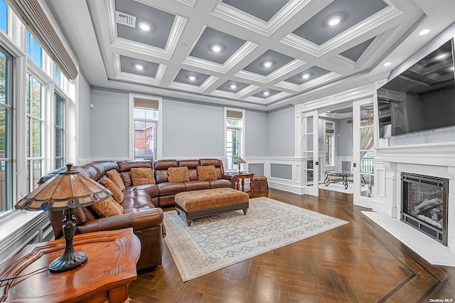 living room with dark parquet flooring, ornamental molding, coffered ceiling, and beam ceiling