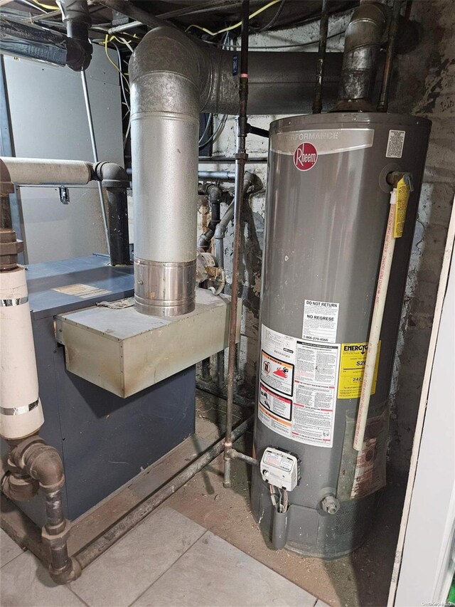 utility room featuring gas water heater