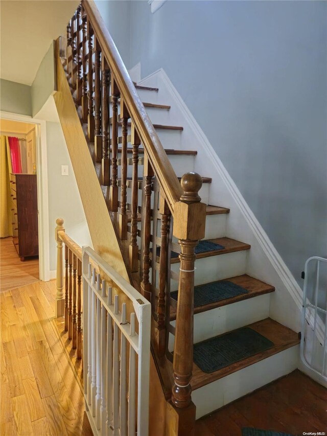 stairway featuring hardwood / wood-style flooring