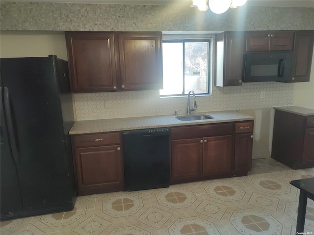 kitchen with sink, backsplash, and black appliances