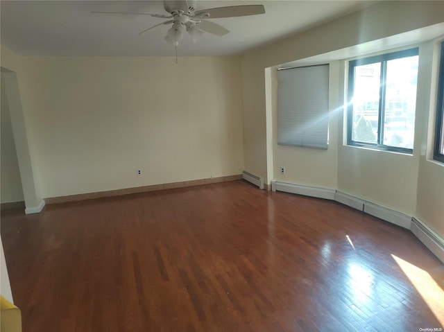 unfurnished room with ceiling fan, wood-type flooring, and a baseboard heating unit