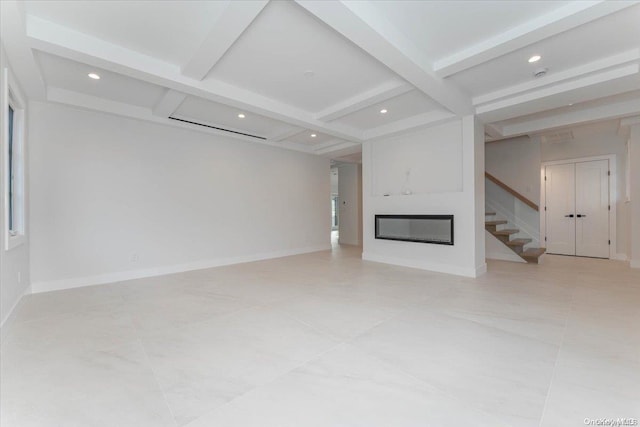 unfurnished living room featuring coffered ceiling and beamed ceiling