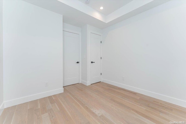 spare room with light hardwood / wood-style flooring