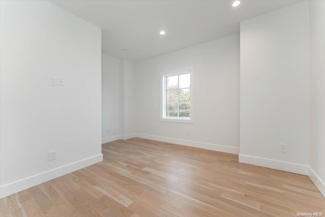 spare room with light hardwood / wood-style flooring