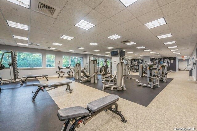 workout area featuring a drop ceiling