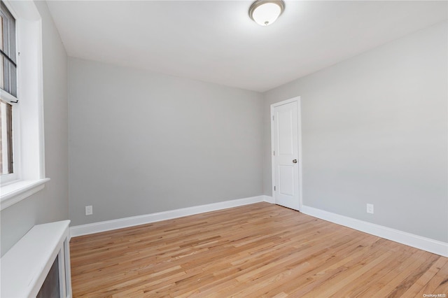 unfurnished room with light hardwood / wood-style flooring