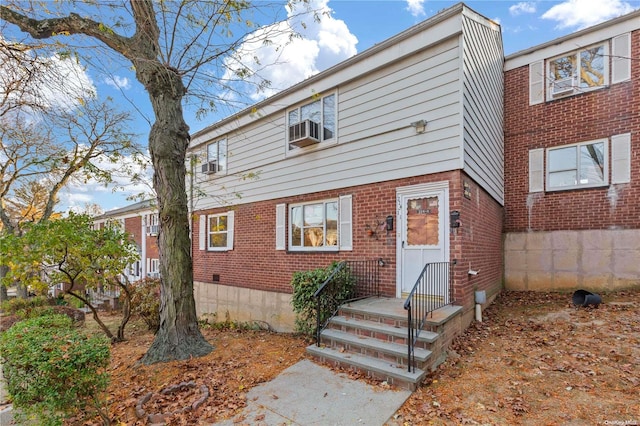 view of front of home with cooling unit