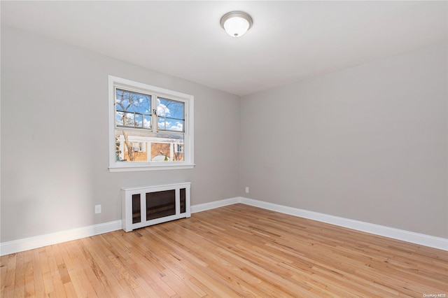 spare room featuring light hardwood / wood-style floors