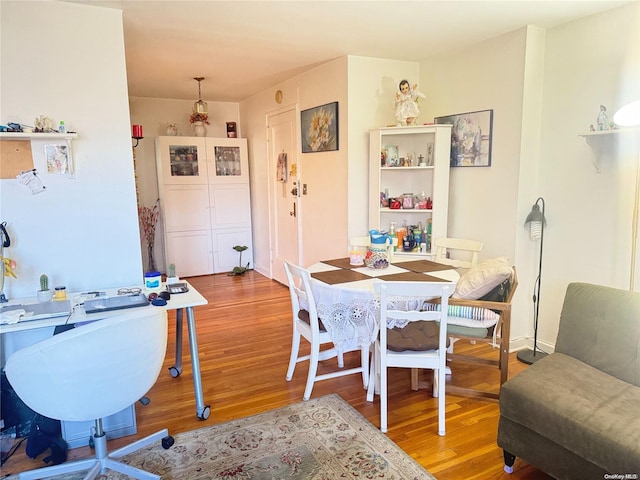 dining room with hardwood / wood-style floors