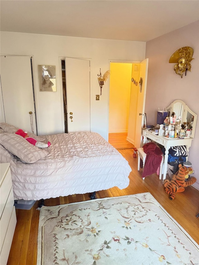 bedroom with light wood-type flooring