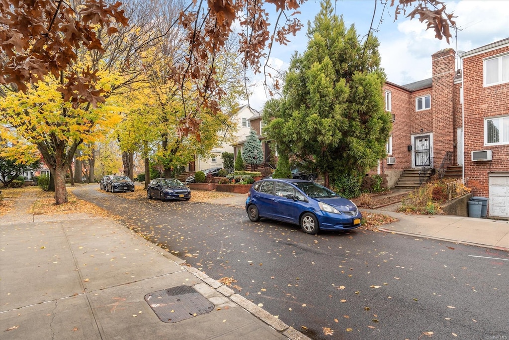 99-10 74th Ave, Forest Hills, NY 11375 - view of asphalt street featuring sidewalks and curbs