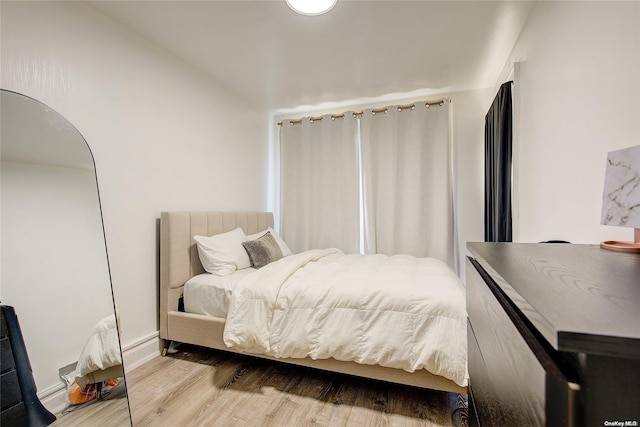 bedroom featuring hardwood / wood-style floors